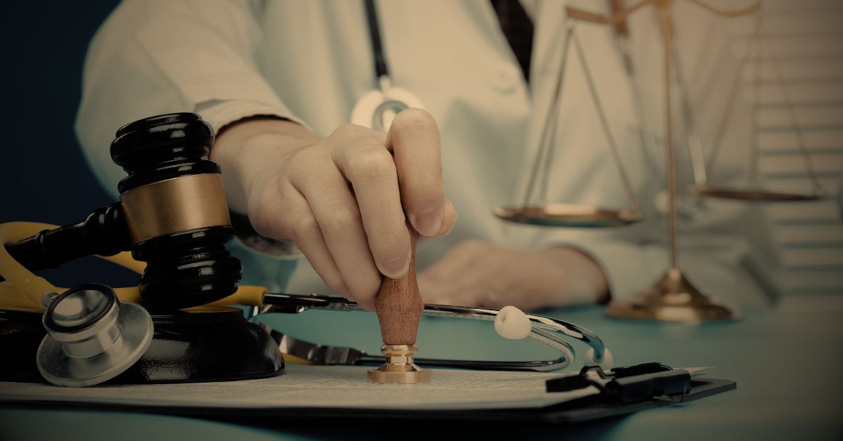 Doctor stamping a legal document with a gavel and scales of justice in the background.