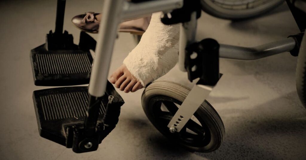 Florida personal injury attorney helping injured client in wheelchair