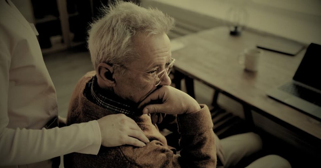 Elderly man showing signs of distress in a nursing home due to unexplained injuries