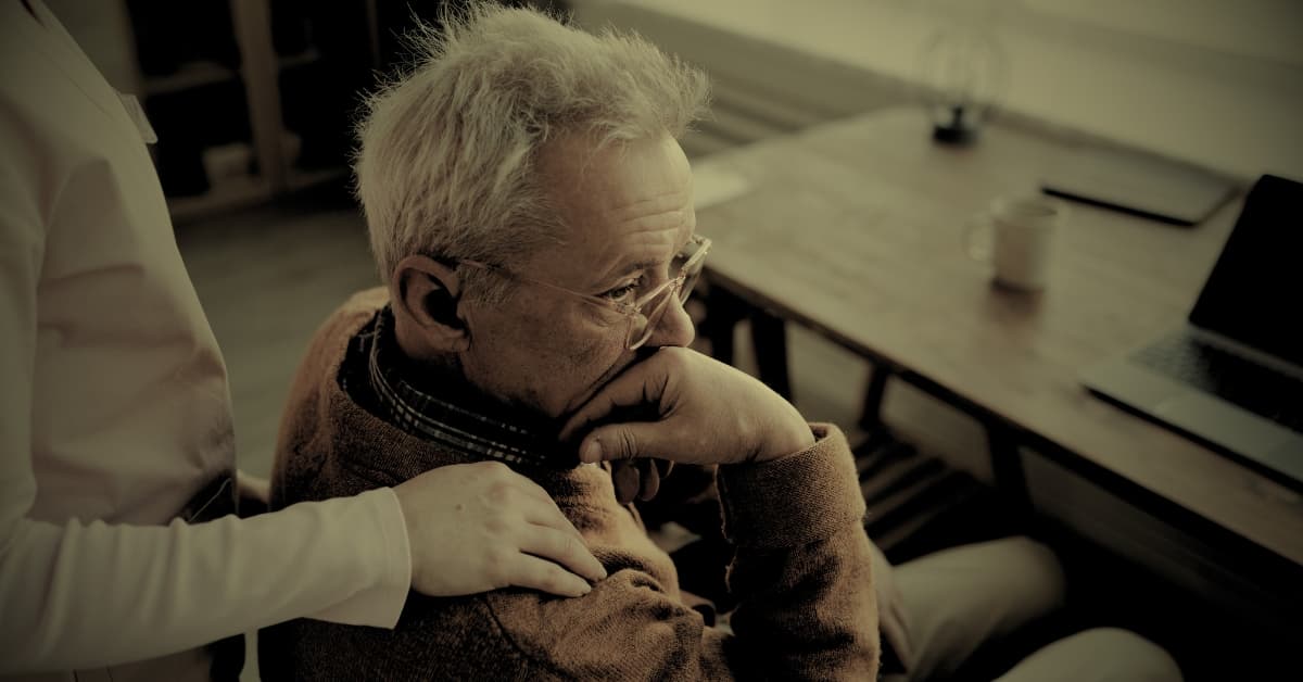 Elderly man showing signs of distress in a nursing home due to unexplained injuries