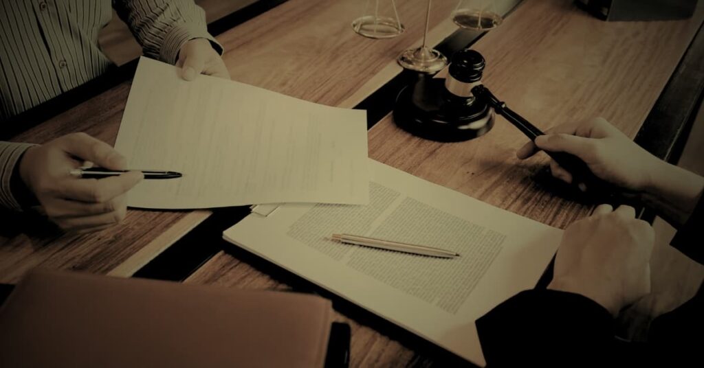 Florida defamation law attorney reviewing legal documents with client