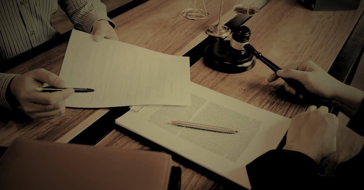 Florida defamation law attorney reviewing legal documents with client