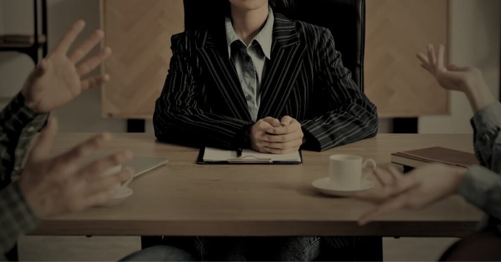 Business partnership dispute Florida — attorney mediating between two partners in a meeting