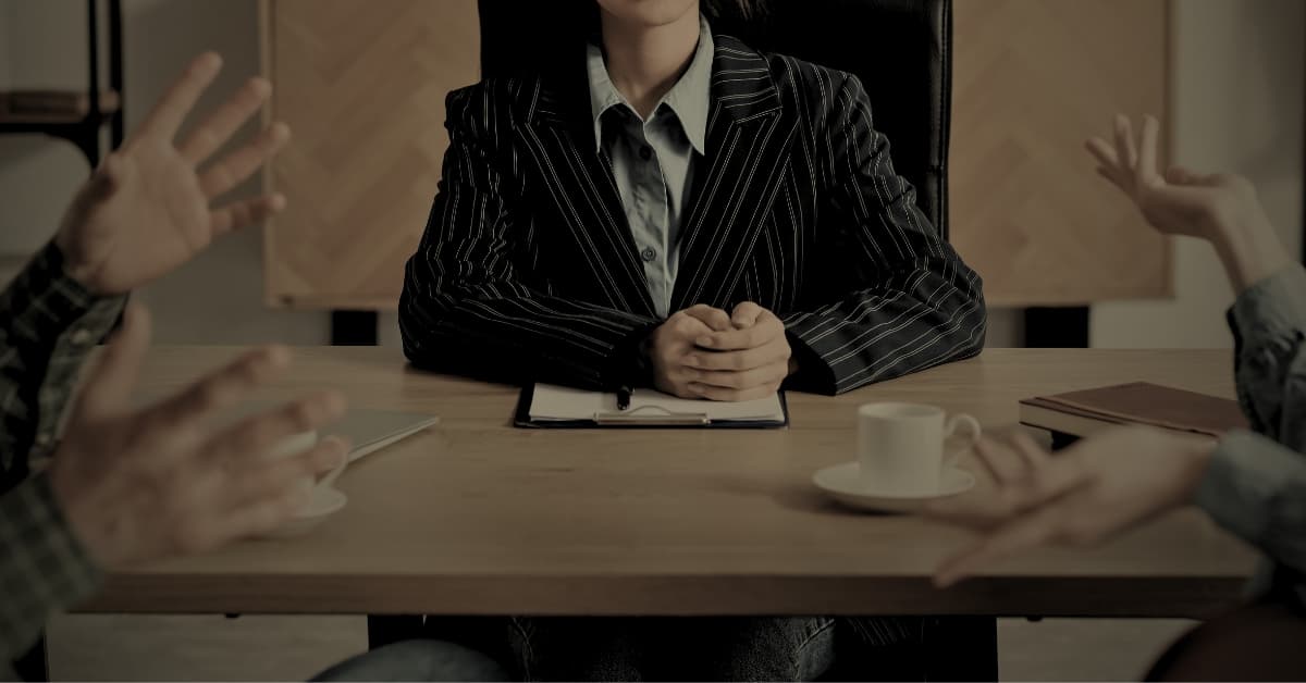 Business partnership dispute Florida — attorney mediating between two partners in a meeting